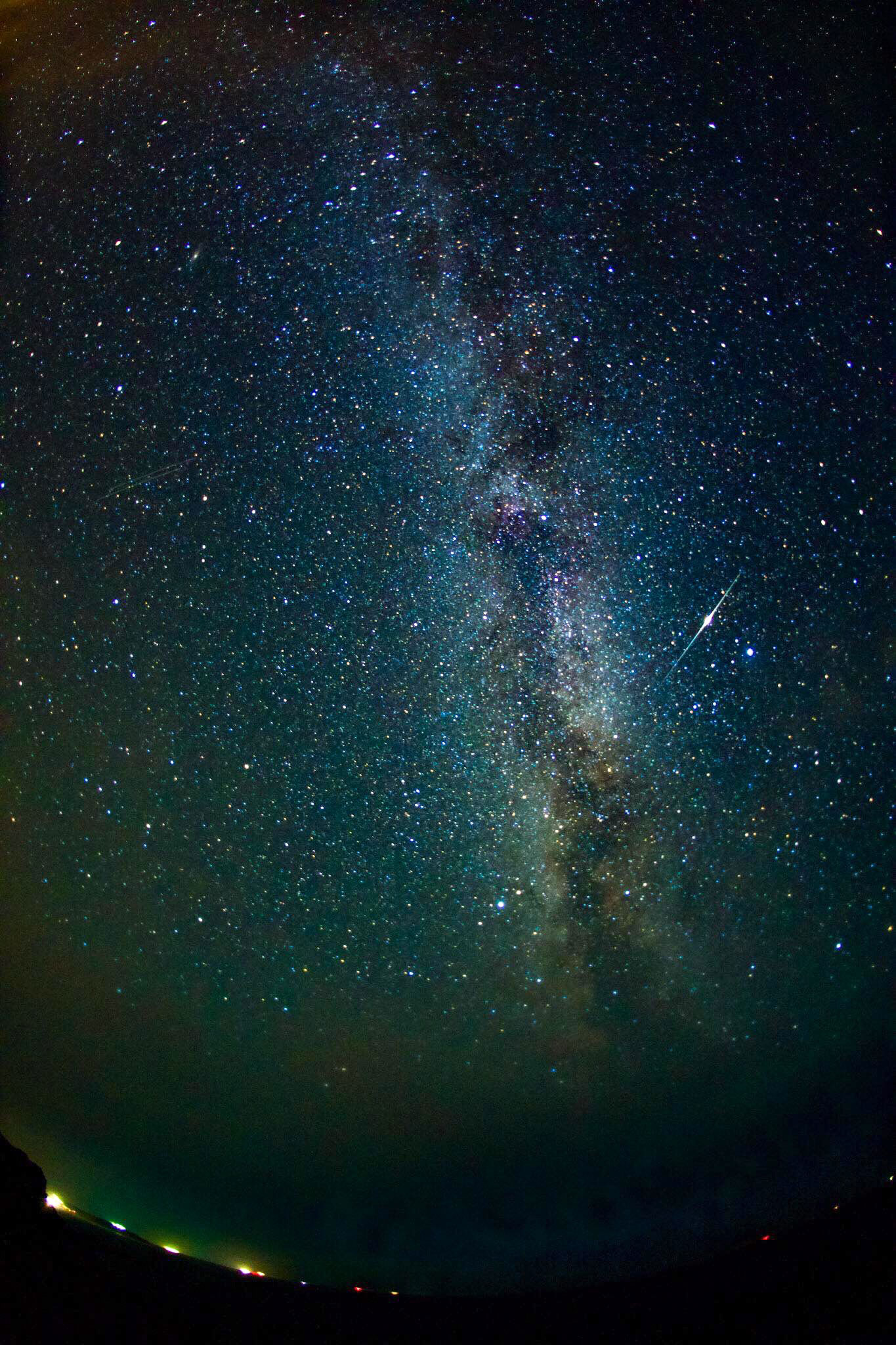 The Milky Way above Porth Nanven, Cornwall, with an Iridium flare.