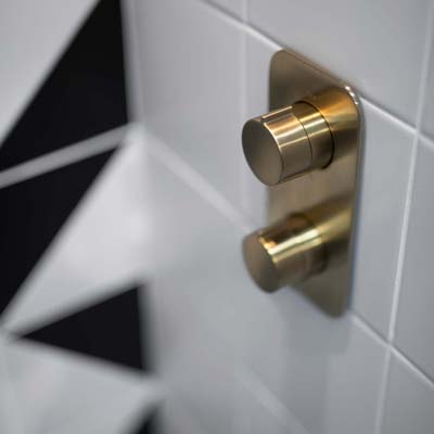 wall mooted thermostatic valve in brushed gold